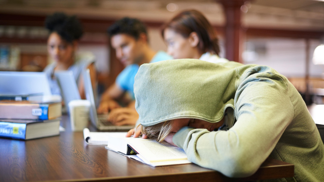 Student resting their head on the desk